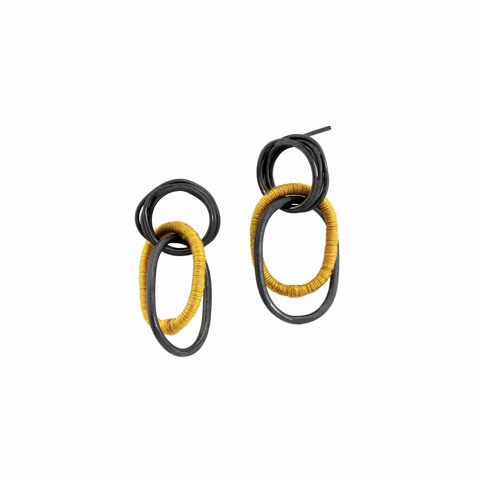 Small Oxidized Sterling Silver Coiled Stud Earrings with interlocking wire dangles, partly wrapped in yellow cotton thread, handmade in Adelaide, South Australia by Melissa Gillespie Jewellery