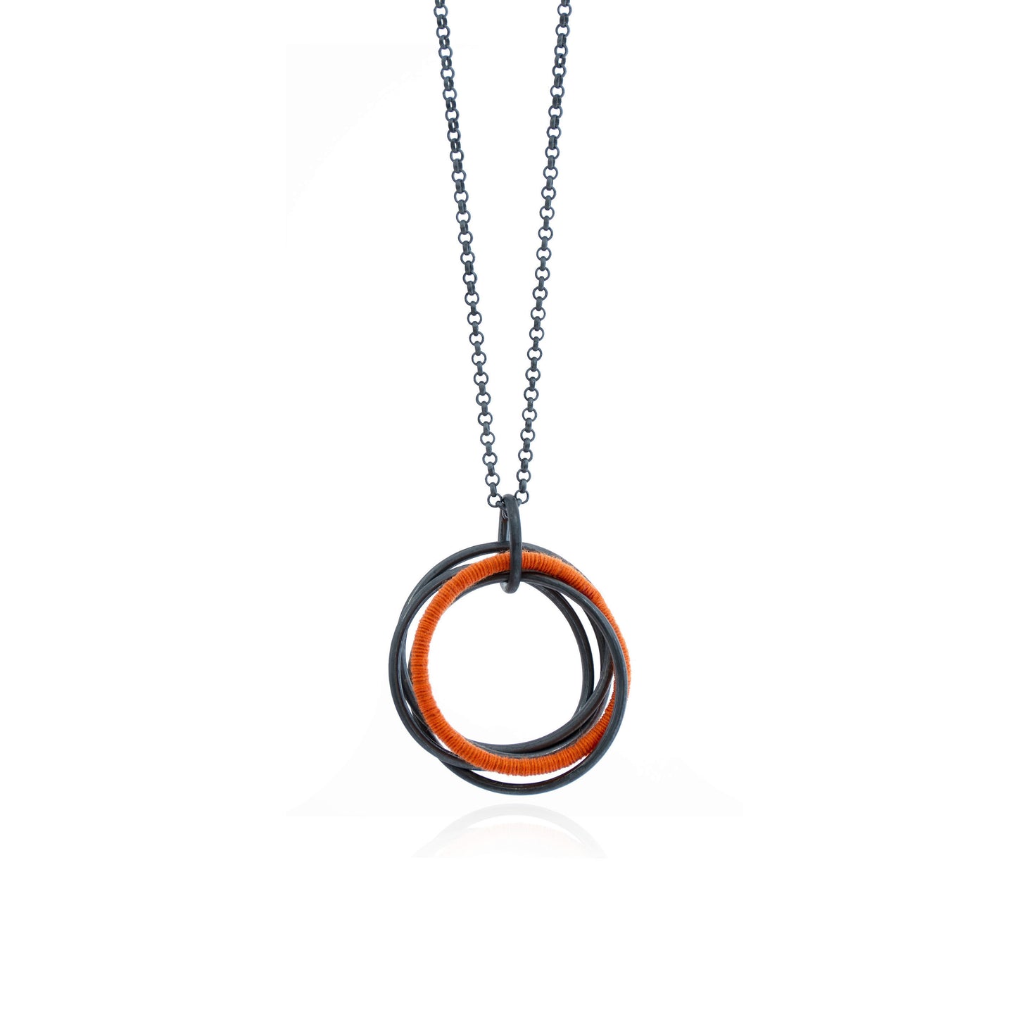 Small Wrapped Orange Oxidized Linked Pendant on Chain features five oxidized sterling silver interlocking circles with one circle wrapped in orange cotton thread, handmade in Adelaide, South Australia by Melissa Gillespie Jewellery