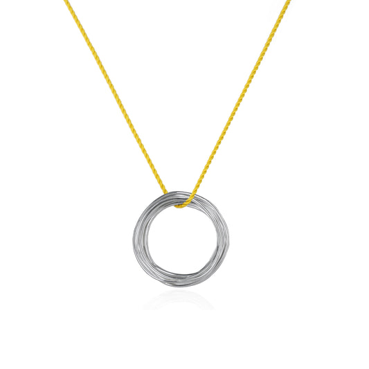 Continuous Circle Pendant on Yellow Silk Cord features a coiled wire pendant in Sterling Silver, handmade in Adelaide, South Australia by Melissa Gillespie 