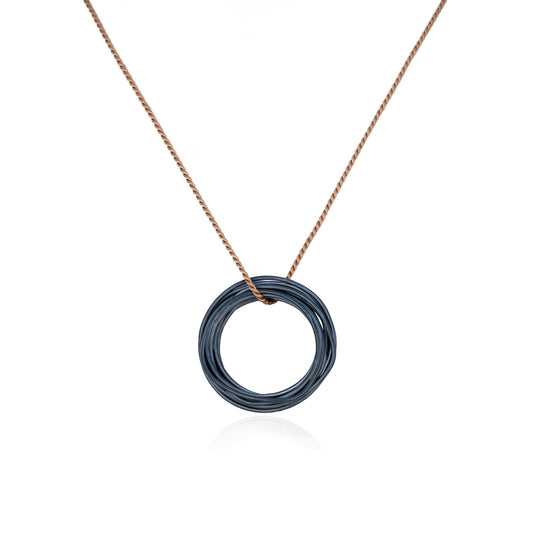 Oxidized Continuous Circle Pendant on Brown Silk Cord features a coiled wire pendant in Oxidized Sterling Silver, handmade in Adelaide, South Australia by Melissa Gillespie Jewellery 