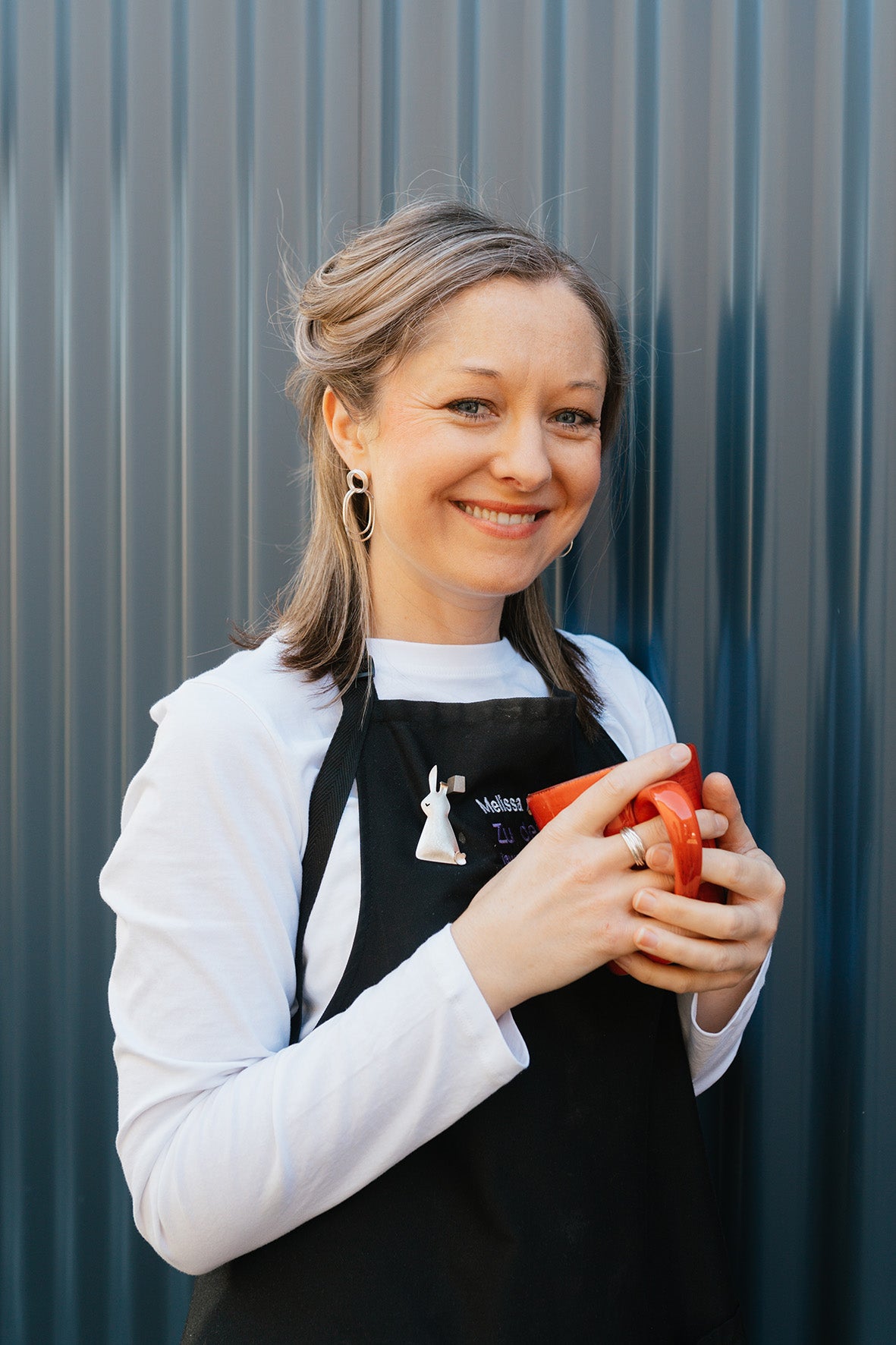 Melissa Gillespie portrait at her home studio in Adelaide, South Australia. Melissa creates handmade Contemporary Jewellery from Sterling Silver for her customers for gifts or personal treats.