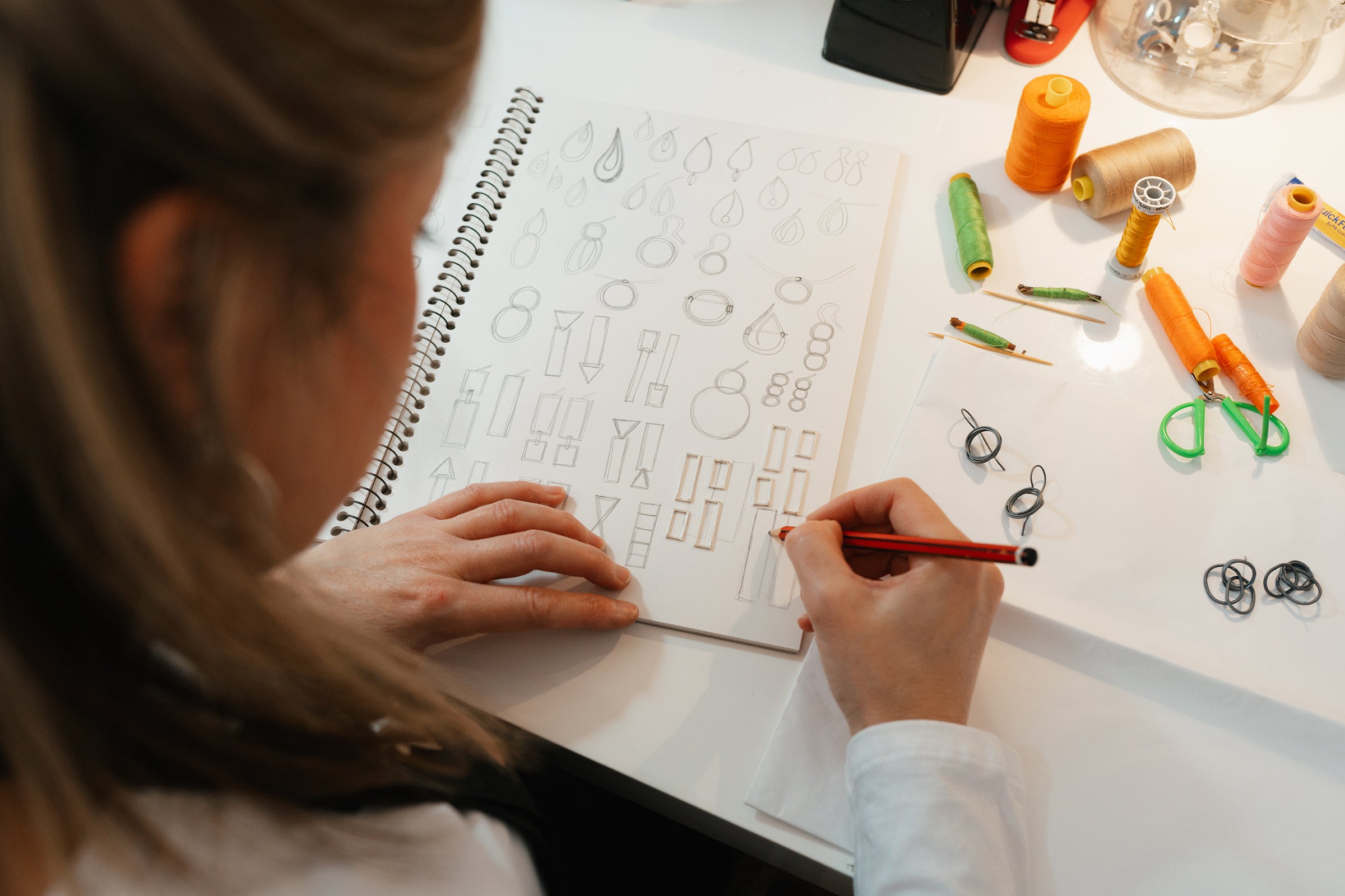 Melissa Gillespie is sketching and drawing some unique designs at her jewellery desk inside her home studio in Adelaide, South Australia. Melissa's Contemporary Jewellery is all handmade from Sterling Silver and make beautiful gifts.